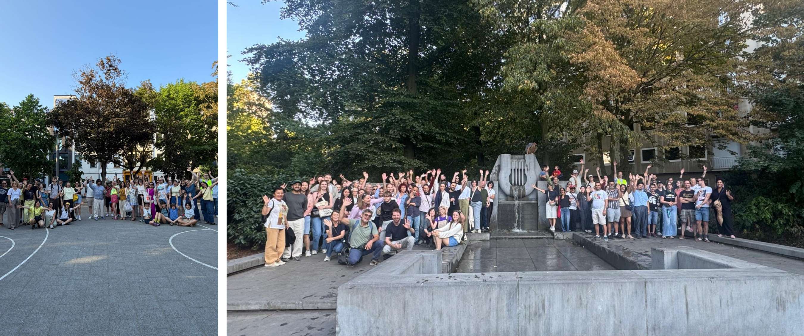 Een grote groep wandelaars poseert en zwaait rond een fontein onder de bomen.